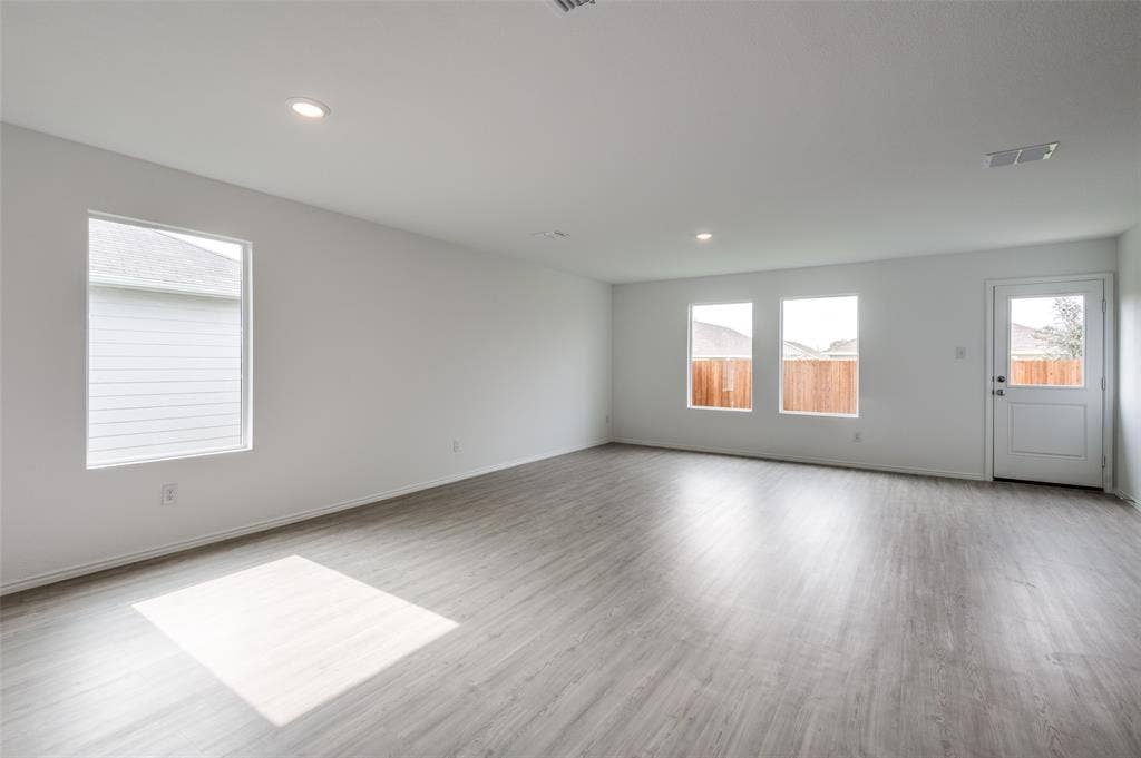 1708 Sims Street, McKinney, TX 75071 Unfurnished room featuring light hardwood / wood-style flooring