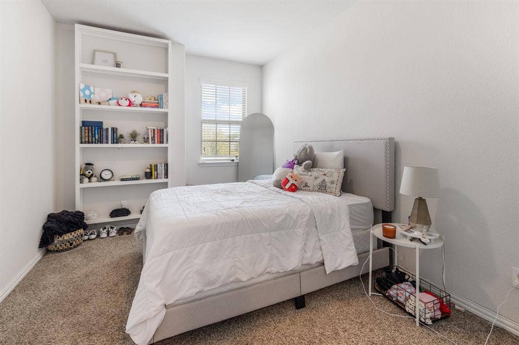 3605 Barby Court, Midlothian, TX 76065 Built-in shelving unit, window with blinds, and carpeted flooring