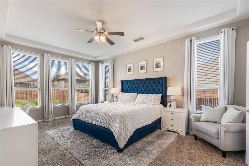 3605 Barby Court, Midlothian, TX 76065 Tray ceiling with recessed lighting, ceiling fan, multiple windows with blinds, and carpeted flooring