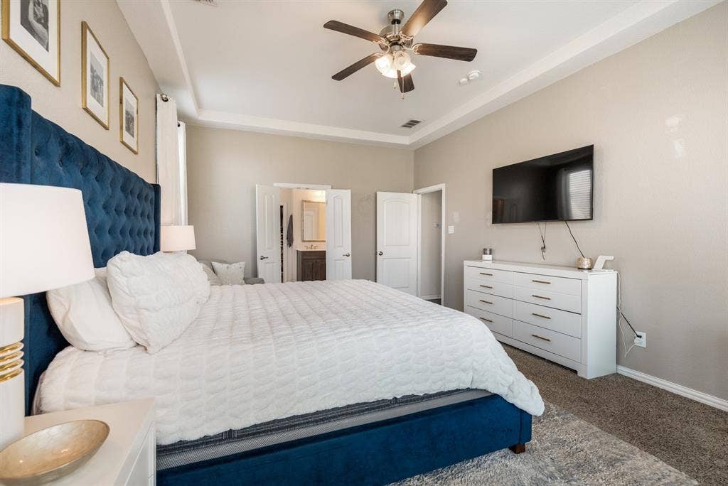 3605 Barby Court, Midlothian, TX 76065 Tray ceiling with crown molding, ceiling fan, carpeted flooring, and light-toned wall paint