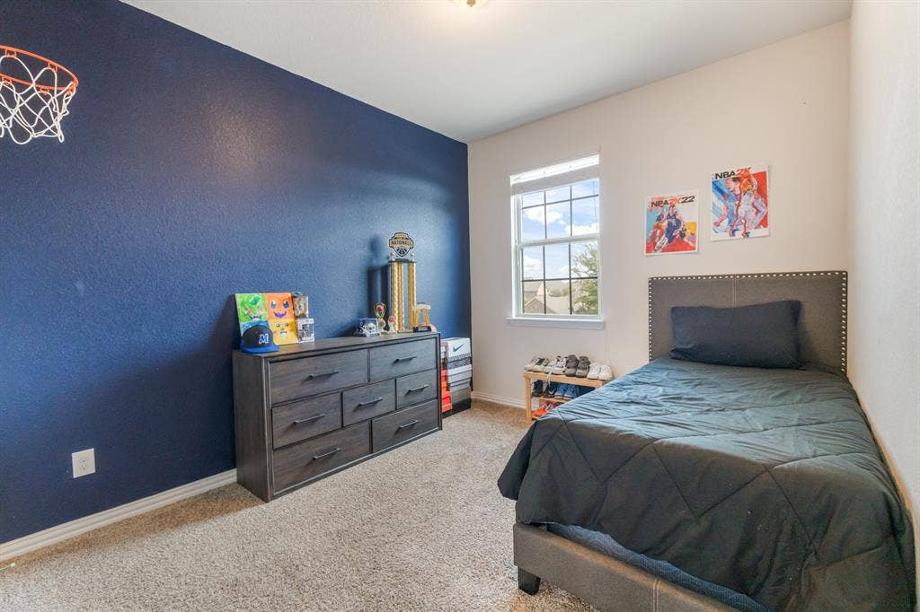 3605 Barby Court, Midlothian, TX 76065 Carpeted bedroom with a single window and a contrasting accent wall