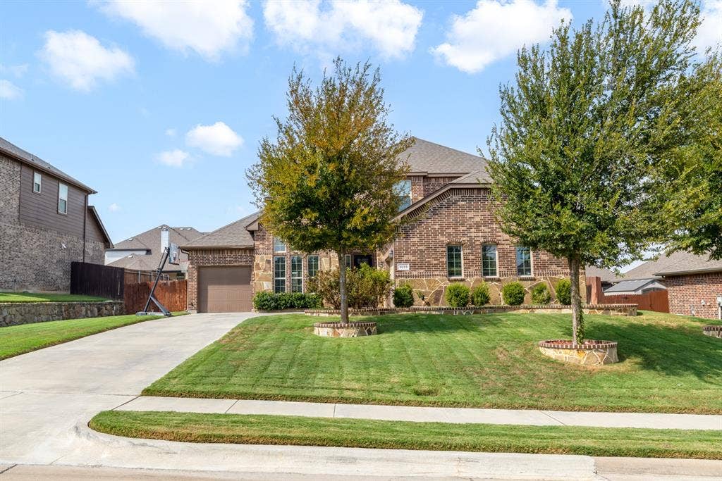3605 Barby Court, Midlothian, TX 76065 Brick and stone facade residence with a concrete driveway and an attached garage