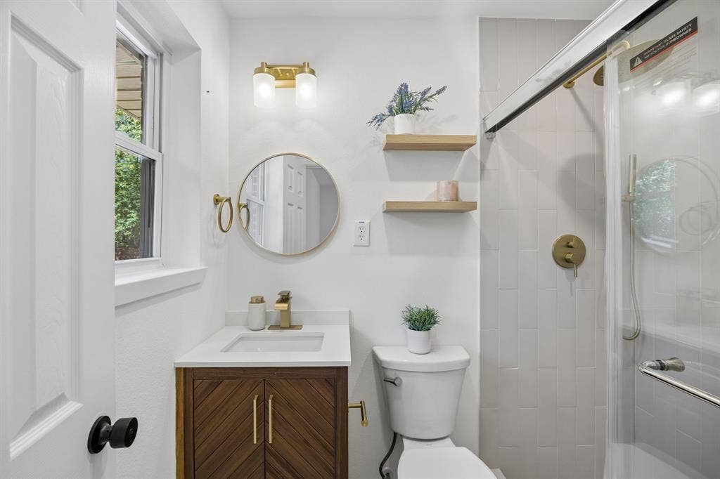 Primary bath with additional storage and large walk in shower