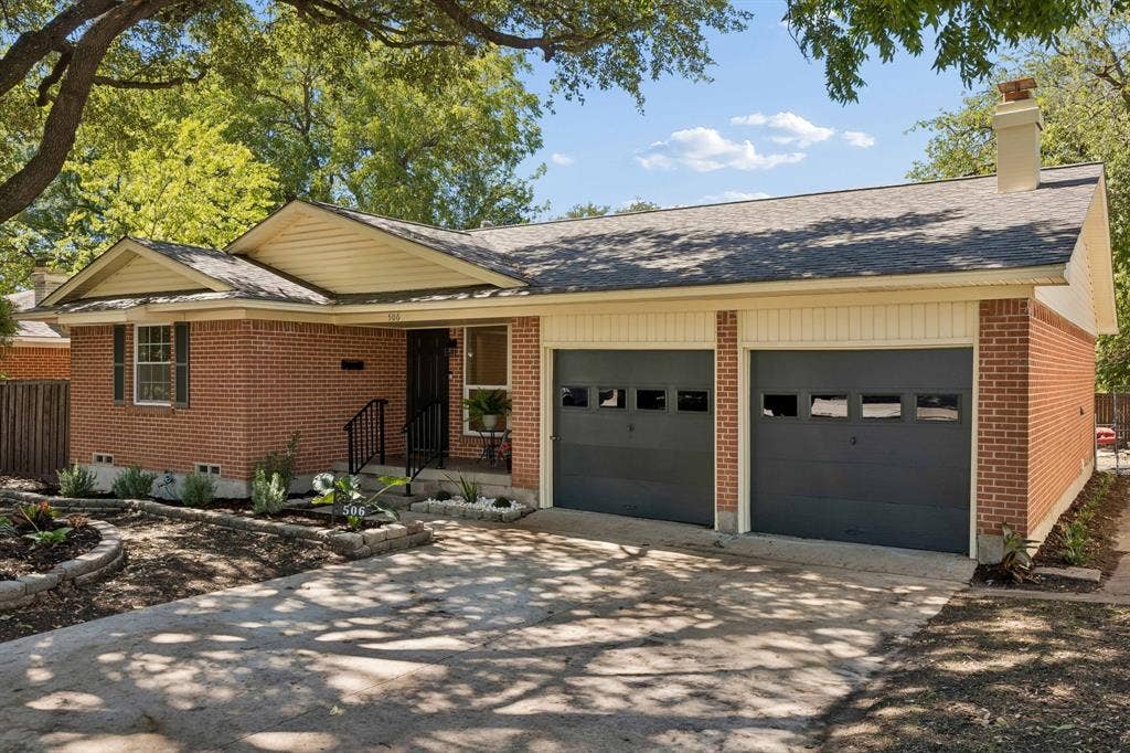 Oversized driveway and an additional 2 car detached garage, ffstreet parking is never a problem here.  Faux garage doors here offer an additional storage 3 ft deep.
