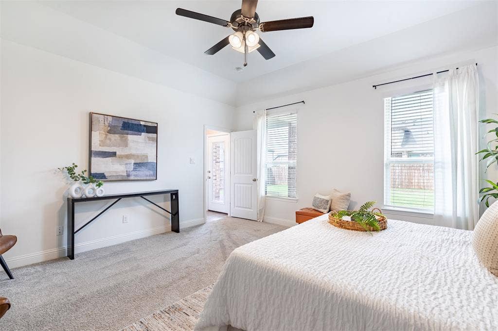 405 Rosie Court, Argyle, TX 76226 Main-level primary suite privately located at the rear of the home, offering convenient first-floor living.