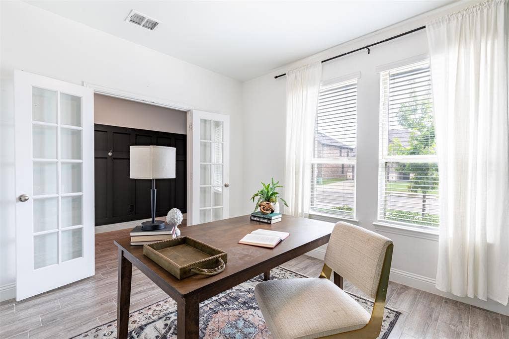 405 Rosie Court, Argyle, TX 76226 Private enclosed home office with elegant French doors, offering a quiet and dedicated workspace.