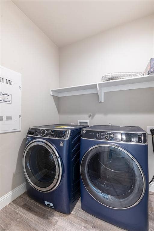 405 Rosie Court, Argyle, TX 76226 Main-level laundry room with front-load washer and dryer, conveniently located for everyday living.