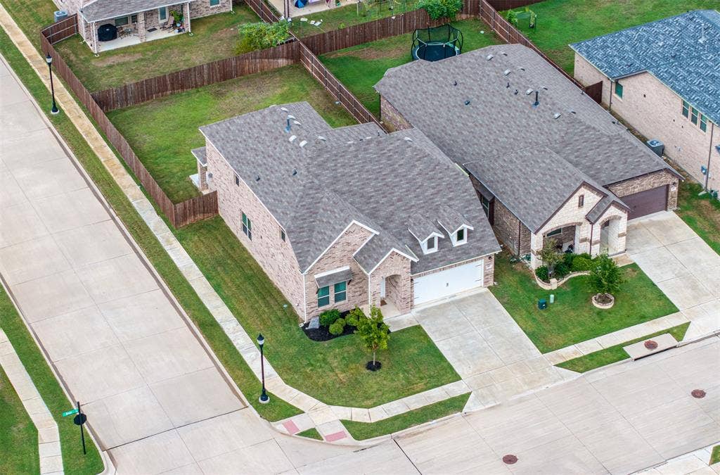 405 Rosie Court, Argyle, TX 76226 Aerial view of this Argyle ISD home showcasing its oversized corner lot, expansive backyard, spacious lot, and exceptional curb appeal.