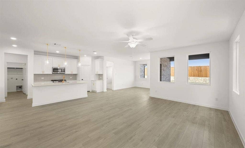 633 Tyronza Drive, Justin, TX 76247 Open Kitchen-Living-Dining Room Representative Photo featuring the Serene Collection