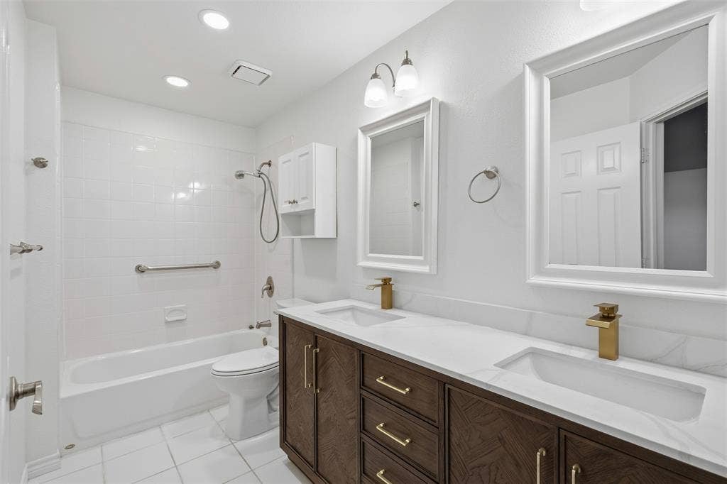 661 Thompson Drive, Coppell, TX 75019 Dual vanity with integrated sinks and gold-tone fixtures