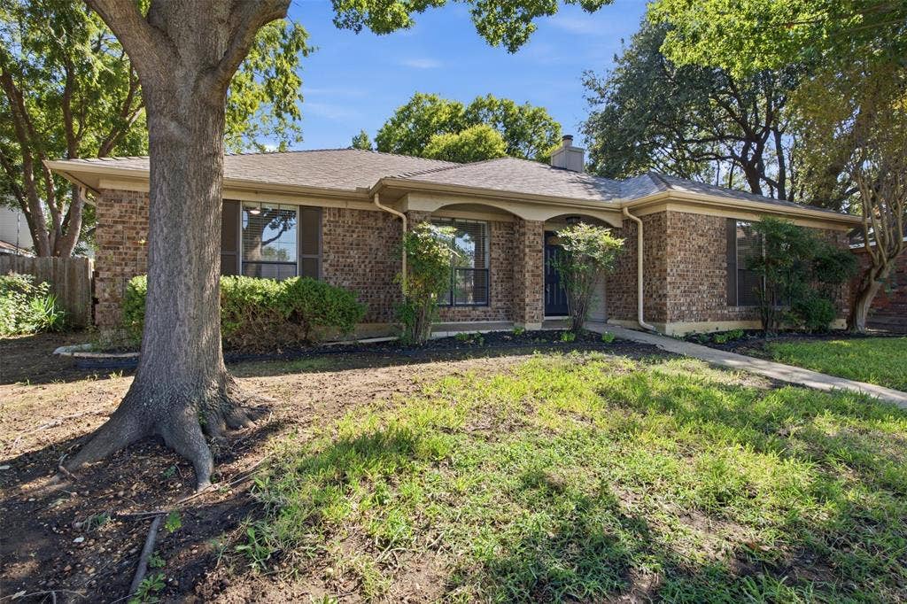 661 Thompson Drive, Coppell, TX 75019 Brick exterior construction with an arched entryway
