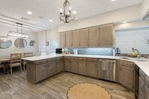 5212 Mustang Trail, Plano, TX 75093 Kitchen featuring wood-finish flooring, recessed lighting, and a chandelier