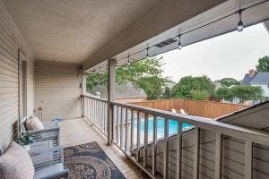 5212 Mustang Trail, Plano, TX 75093 Covered balcony with wood-finish flooring and a balustrade railing