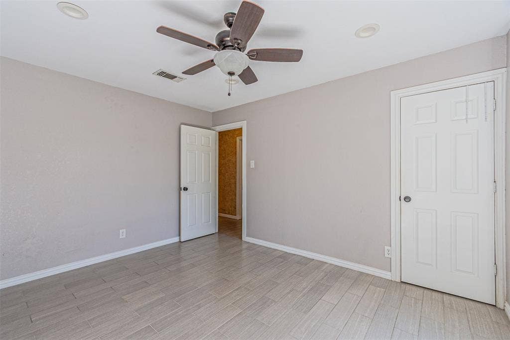 8808 Sylvan Court, Fort Worth, TX 76120 Ceramic plank-style flooring, a ceiling fan with integrated lighting, and recessed ceiling lights