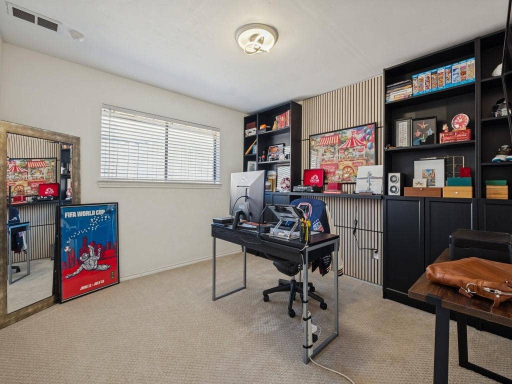 5730 Winding Woods Trail, Dallas, TX 75227 Built-in black cabinetry with open shelving, vertical slat wall paneling, and a contemporary flush-mount ceiling light fixture