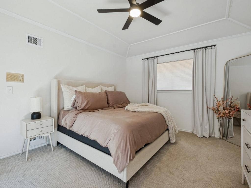 5730 Winding Woods Trail, Dallas, TX 75227 Vaulted ceilings, neutral carpeting, and a matte black ceiling fan with integrated lighting