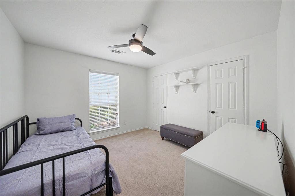 Carpeted flooring complemented by white walls