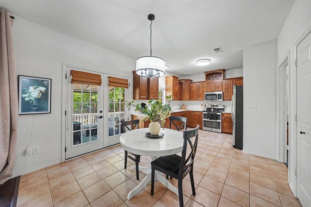 Kitchen featuring wood cabinetry, stainless steel appliances, and white countertops