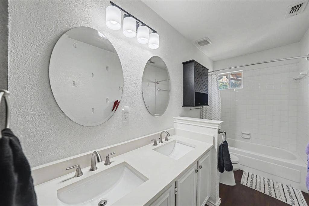 Dual vanity with undermount sinks and chrome fixtures