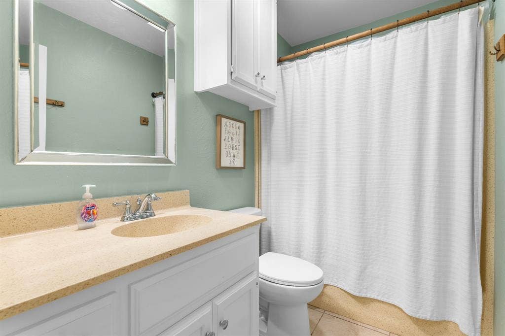 10712 Apache Drive, Waco, TX 76712 Vanity with integrated sink and chrome faucet