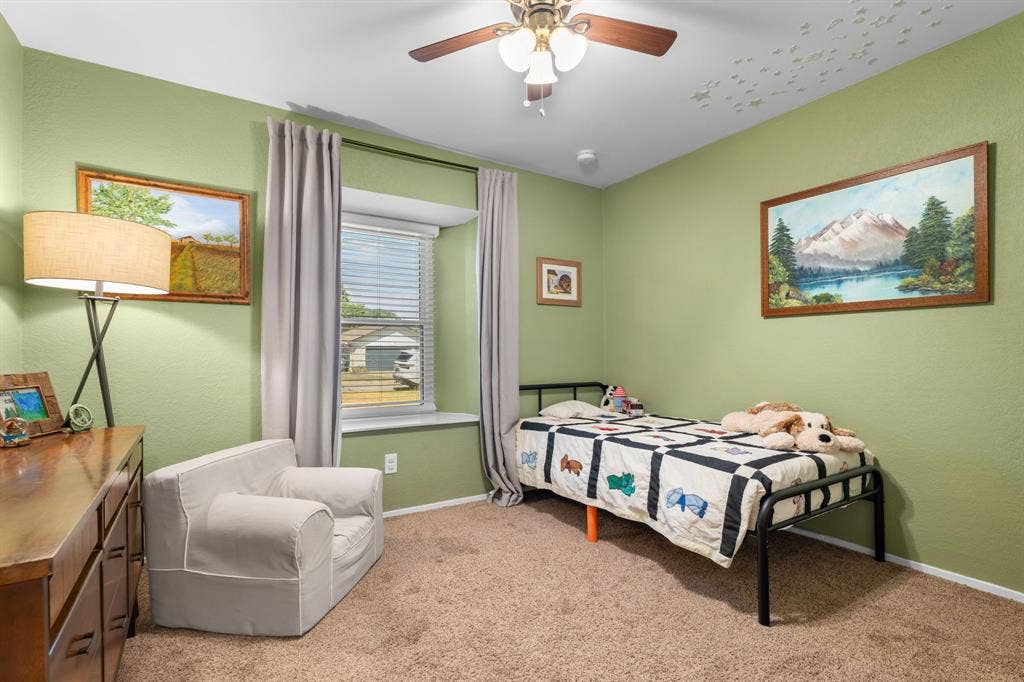 10712 Apache Drive, Waco, TX 76712 Carpeted room featuring a ceiling fan, window with blinds, and light green walls