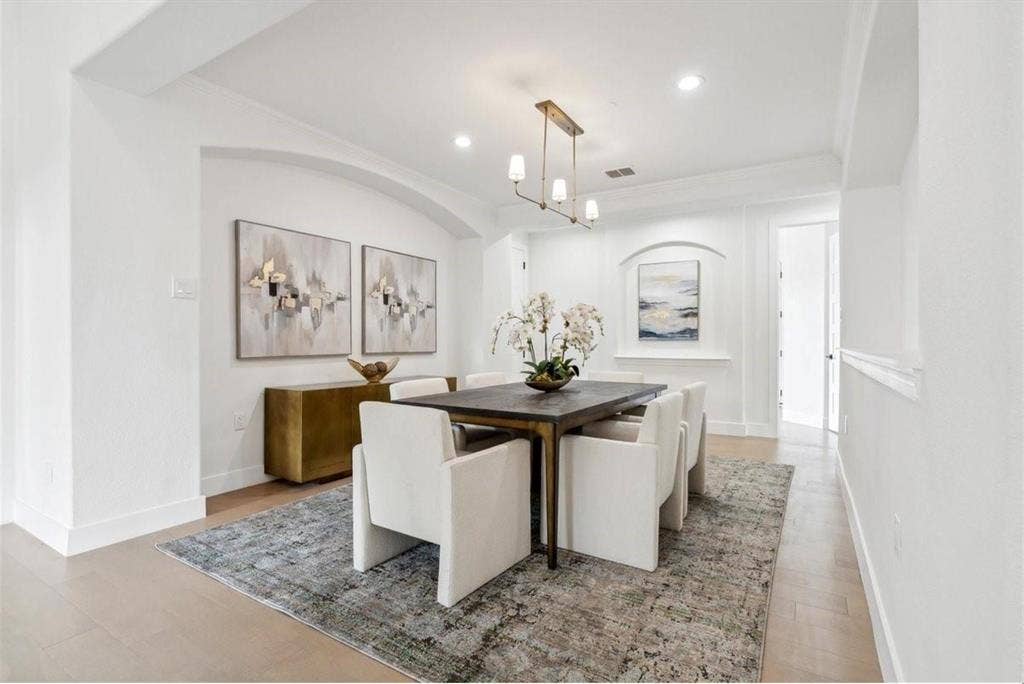 1750 Greenwood Court, Prosper, TX 75078 Recessed ceiling lighting, wood-finish flooring, and a modern linear chandelier
