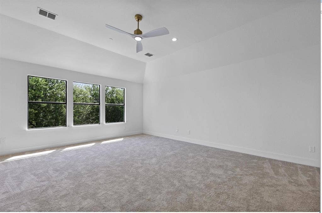1750 Greenwood Court, Prosper, TX 75078 Vaulted ceiling, recessed lighting, ceiling fan, three windows, and carpeted flooring