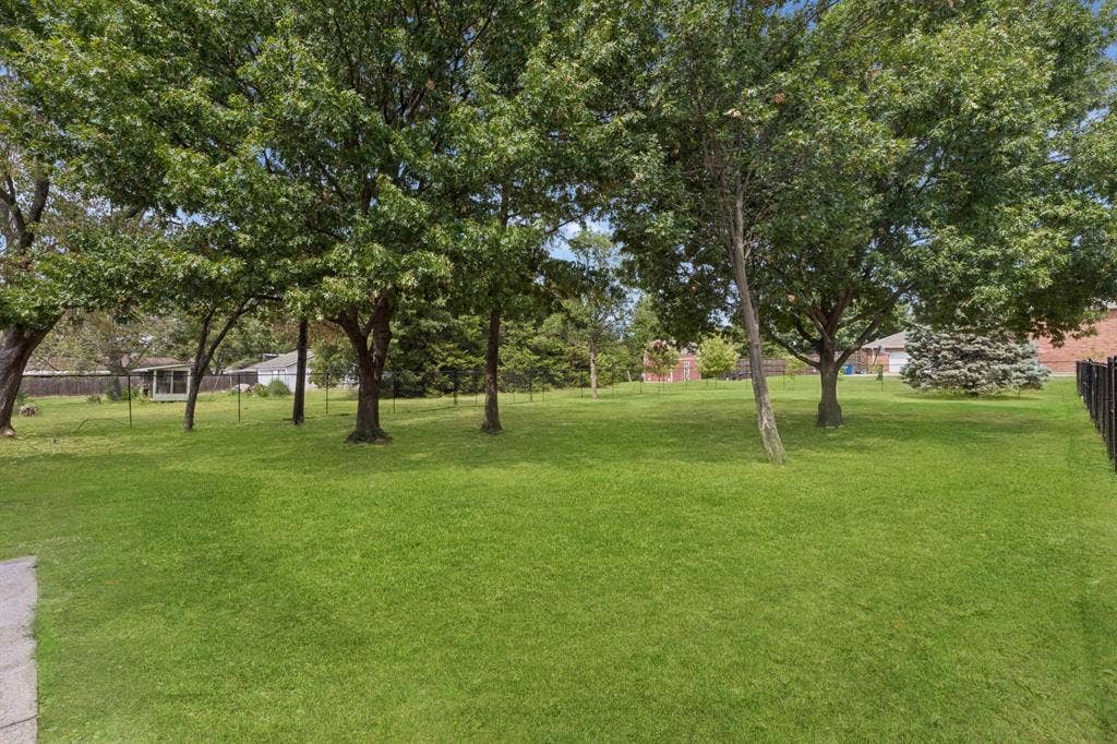 1609 Blackburn Road, Sachse, TX 75048 On almost an acre with NO HOA and mature trees!