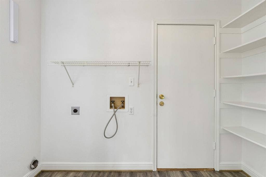 1609 Blackburn Road, Sachse, TX 75048 spacious utility room. The door leads out to the oversized 24x18 garage with utility sink!