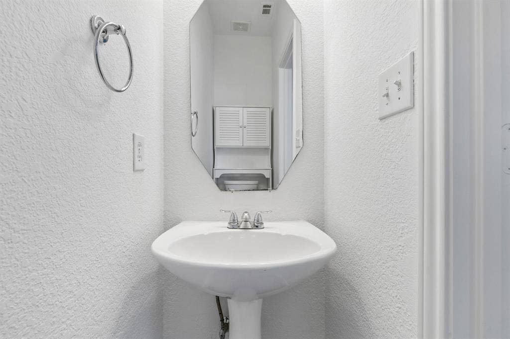 1609 Blackburn Road, Sachse, TX 75048 Powder Bath downstairs conveniently located off Living Room