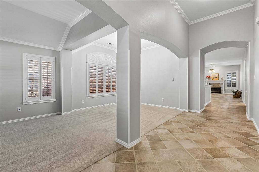 Spacious entryway, brand new carpet, and plantation shutters throughout the home