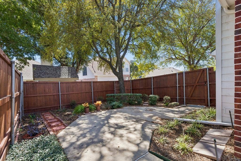 Cute backyard with driveway access
