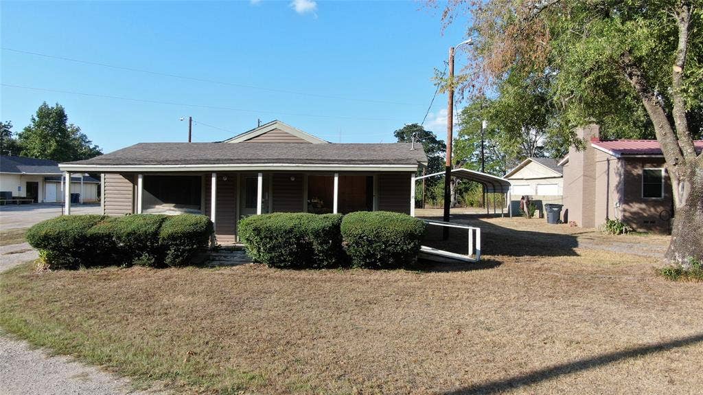 7544 N US HIGHWAY 69 Highway, Alba, TX 75410 Siding exterior with a covered front porch and a carport structure
