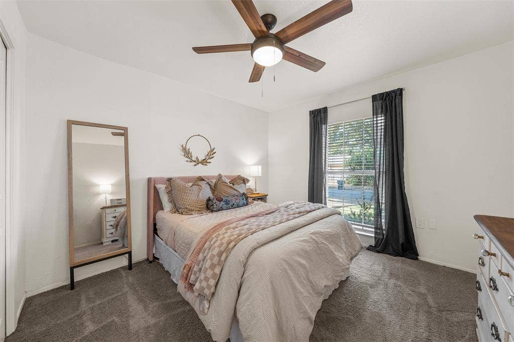1712 Laurel Lake Drive, Waco, TX 76710 Neutral wall paint, ceiling fan with integrated lighting, window with blinds, carpeted flooring