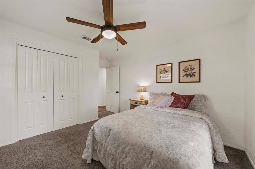1712 Laurel Lake Drive, Waco, TX 76710 Room featuring neutral wall tones, bi-fold closet doors, and carpet flooring