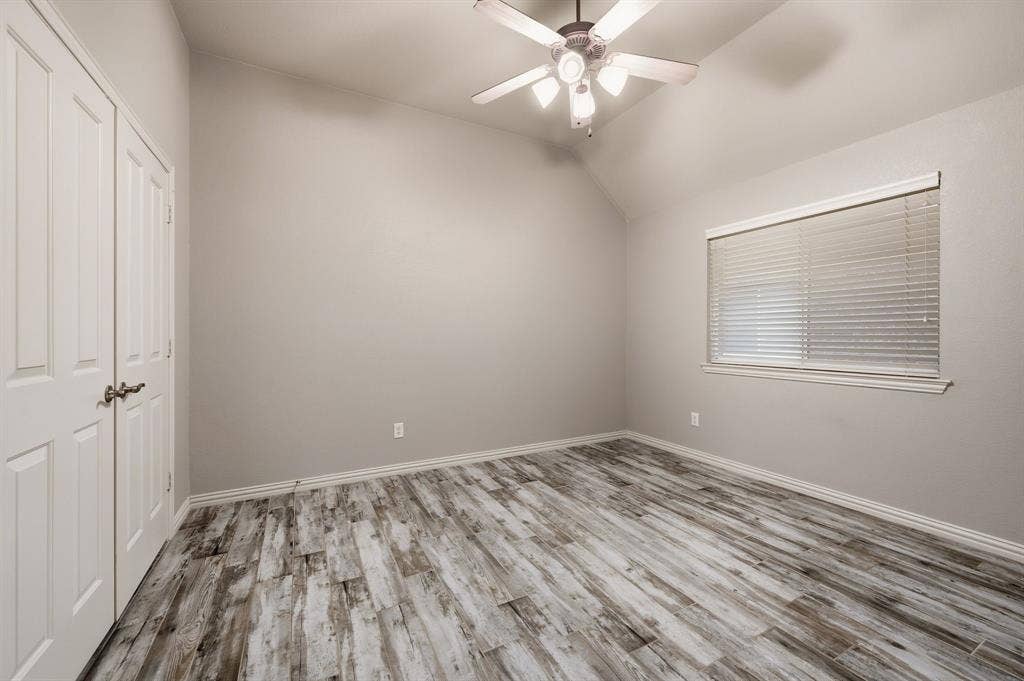 307 Park Haven Boulevard, Euless, TX 76039 Vaulted ceiling with a ceiling fan, wood-finish flooring, and a window with blinds