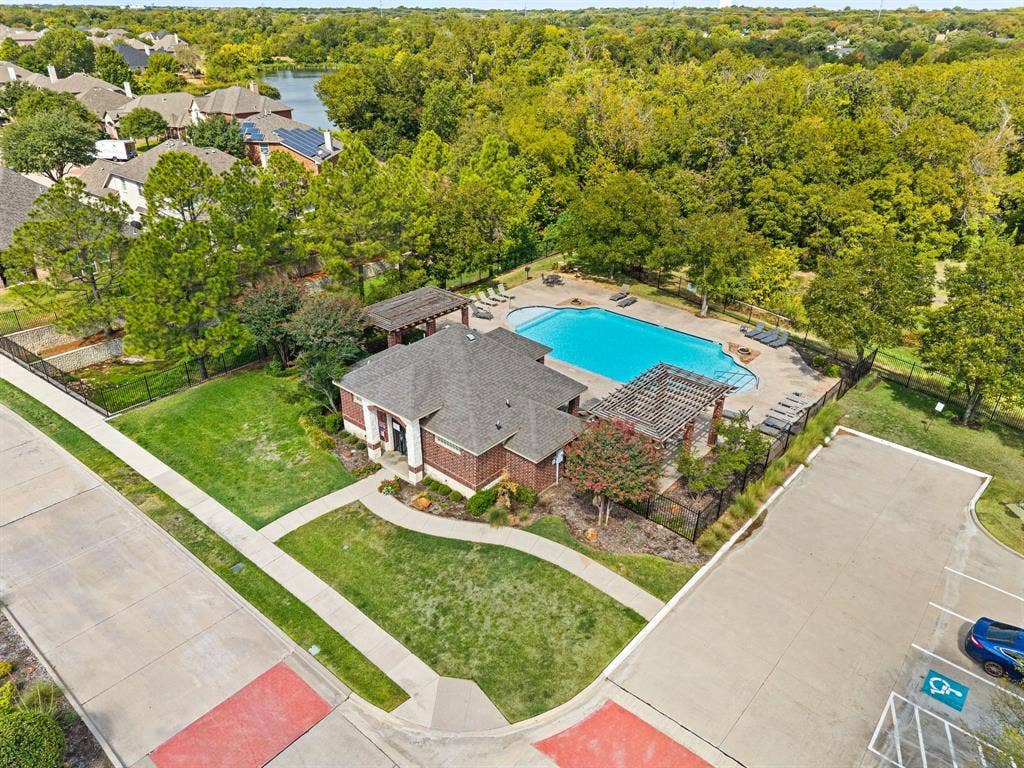 307 Park Haven Boulevard, Euless, TX 76039 Community Pool with brick exterior, gabled roof, and adjacent swimming pool
