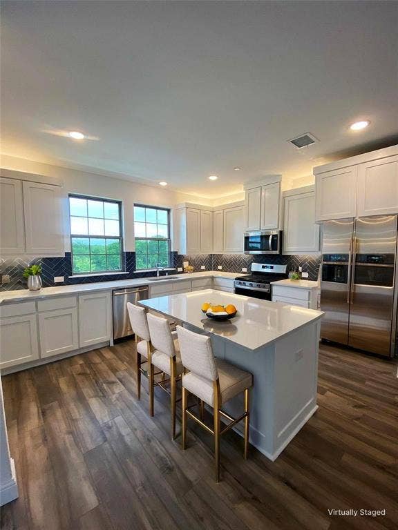 7297 Sacaton Trail, Frisco, TX 75033 Quartz Island and Cabinets Galore with Greenbelt Views From Sink Area
