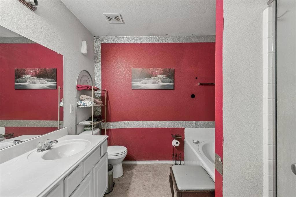 3118 Rosslynn Court, Seagoville, TX 75159 Vanity with integrated sink, chrome-finish faucet, and expansive mirror