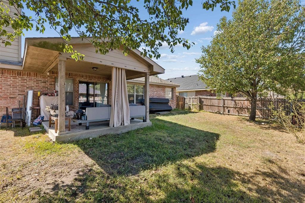 3118 Rosslynn Court, Seagoville, TX 75159 Covered patio with a concrete slab, wood support posts, and brick exterior