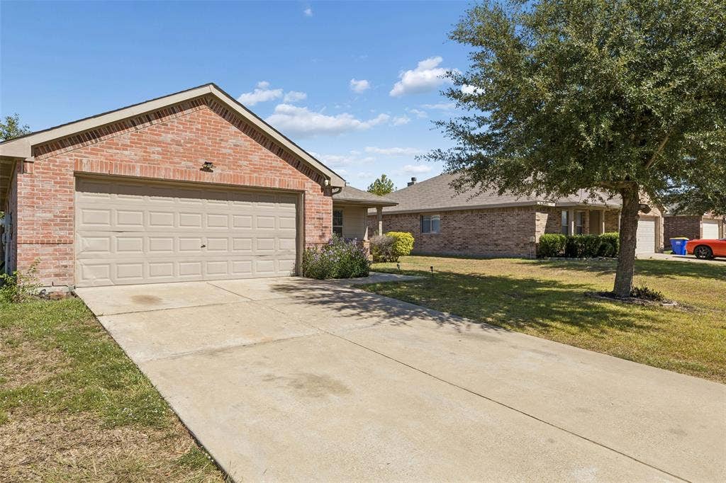 3118 Rosslynn Court, Seagoville, TX 75159 Brick exterior with a gabled roofline