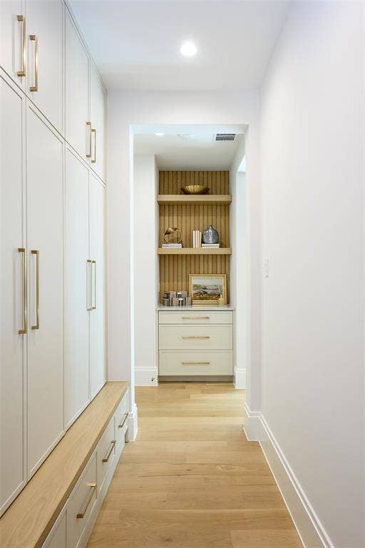 3929 Stanford Avenue, University Park, TX 75225 Mudroom with floor-to-ceiling locker-style cabinetry, key drop with floating shelves and reeded accent material