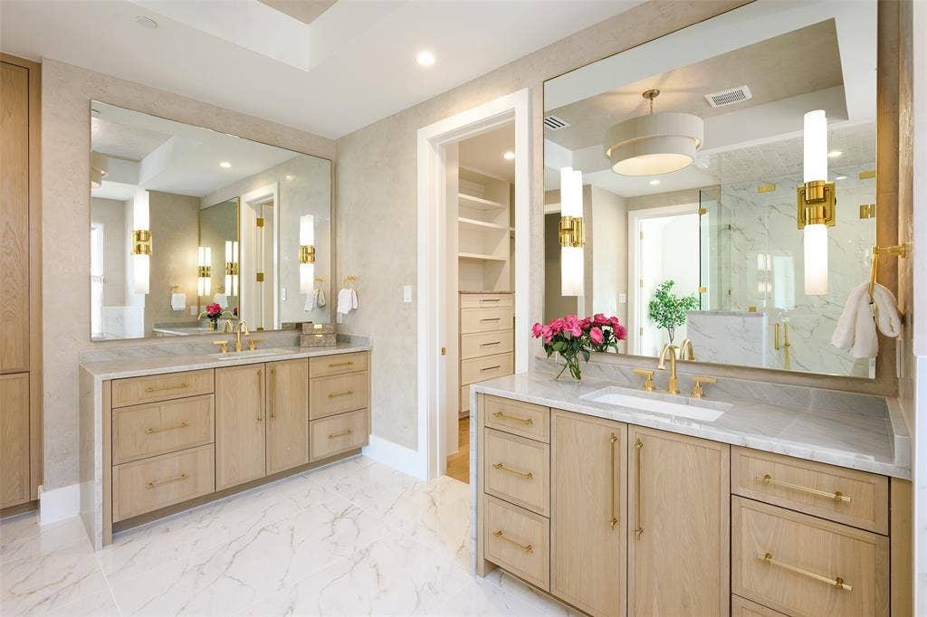 3929 Stanford Avenue, University Park, TX 75225 Primary bath with Venetian plaster walls, waterfall-style stone countertops and white oak soft-close cabinetry, free standing tub, walk-in shower and walk-in custom closet