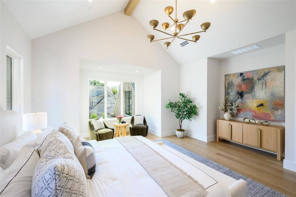 3929 Stanford Avenue, University Park, TX 75225 Spacious primary suite with vaulted ceiling and white oak ceiling beams, sitting area and windows overlooking backyard