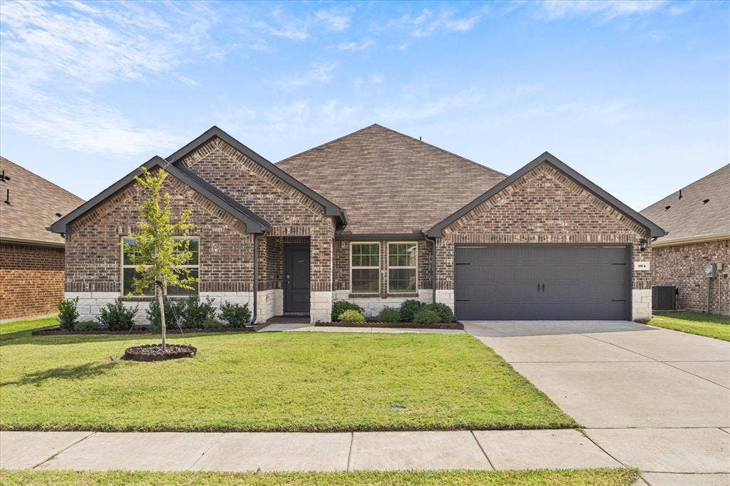 164 Mapleoak Drive, Caddo Mills, TX 75135 Stunning curb appeal welcomes your arrival