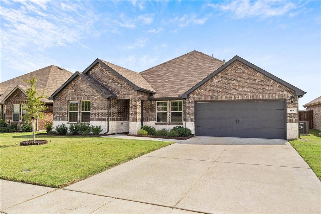 164 Mapleoak Drive, Caddo Mills, TX 75135 2 car garage and extended driveway provides ample parking for family and friends