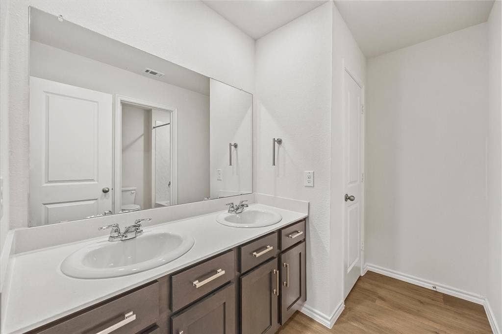 164 Mapleoak Drive, Caddo Mills, TX 75135 Auxiliary full bath includes dual sinksand tons of cabinetry for storeage!