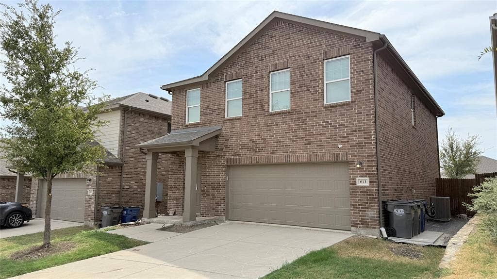 613 Delaware Avenue, Princeton, TX 75407 Brick exterior with a covered entry