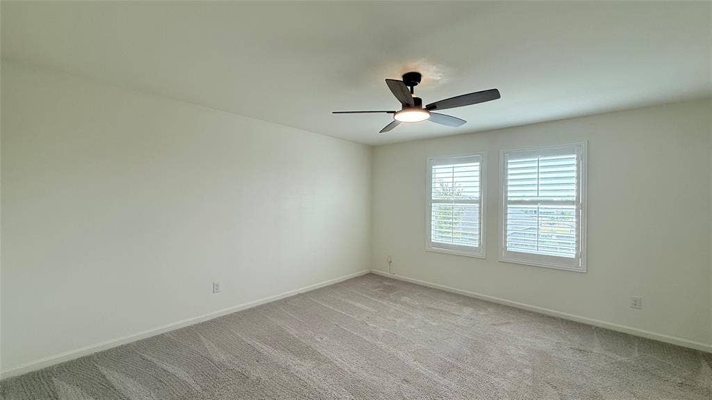 613 Delaware Avenue, Princeton, TX 75407 Recessed lighting, ceiling fan, two windows with plantation shutters, and neutral carpeting