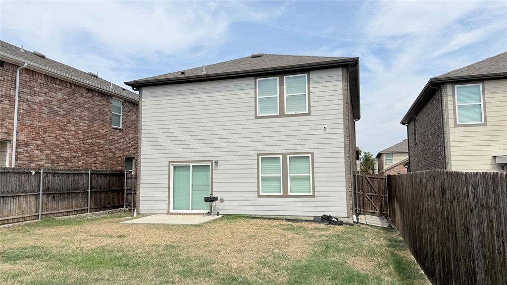 613 Delaware Avenue, Princeton, TX 75407 Private fenced backyard with a concrete patio